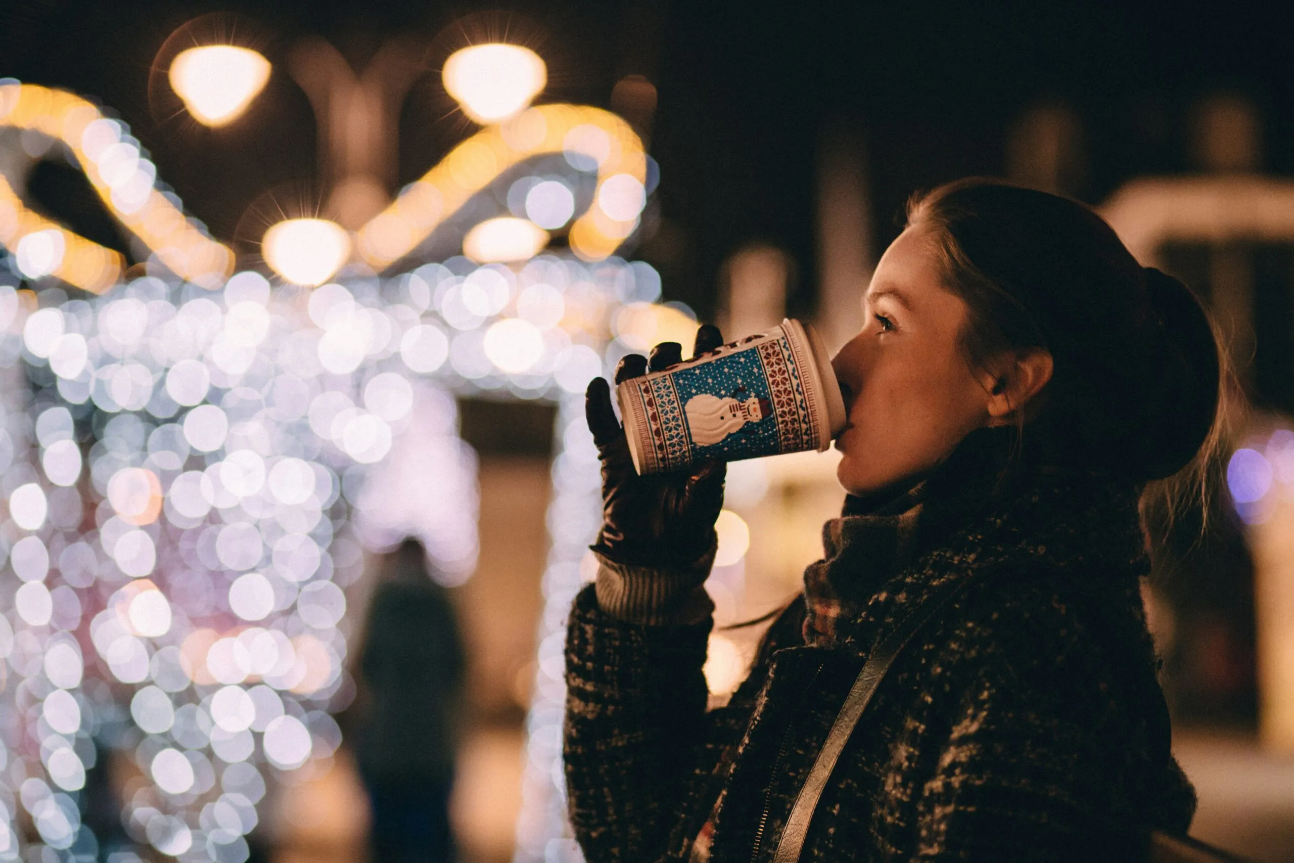 woman drinking a warm drink in winter