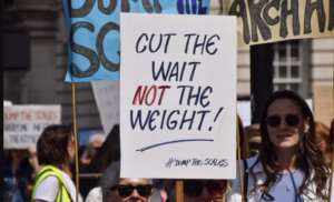 Image via Guardian, Dump the Scales march - diet culture and politics.